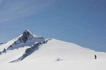 First Nations mountaineer exploring high altitudes, fur clothing. - CAVF89194