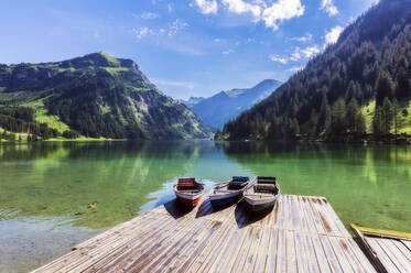 Motorboats left on lakeshore jetty in Tannheimer Tal - THAF02842