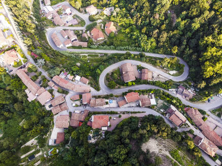 Drone view of roads winding through rural town - MEUF02044