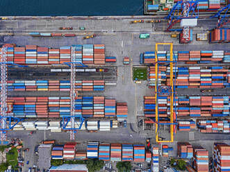 Russia, Primorsky Krai, Vladivostok, Aerial view of cargo containers in commercial dock - KNTF05386