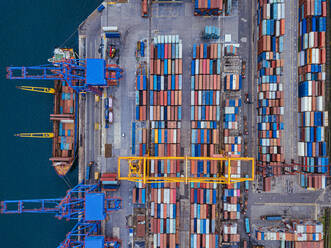 Russia, Primorsky Krai, Vladivostok, Aerial view of cargo containers in commercial dock - KNTF05390