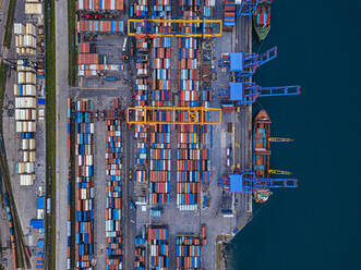 Russia, Primorsky Krai, Vladivostok, Aerial view of cargo containers in commercial dock - KNTF05391