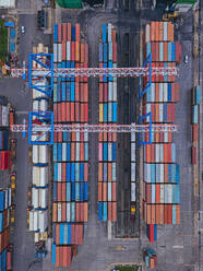 Russia, Primorsky Krai, Vladivostok, Aerial view of cargo containers in commercial dock - KNTF05392