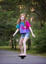Pre Teen Red Haired Girl Ripsticking - CAVF89304
