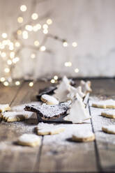 Tree shaped Christmas cookies with powdered sugar - SBDF04338