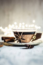 Cup of mulled wine with cinnamon sticks and star anise - SBDF04364