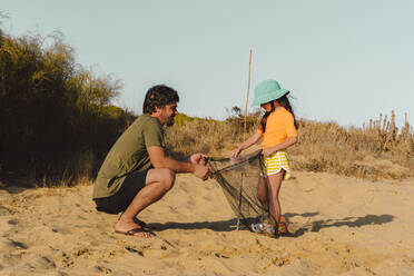 Kids in water using fishing net, Sanibel Island, Pine Island Sound