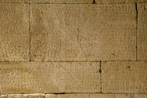 Alphabet carved on stonewall at Odeon Of Gortyn, Crete, Greece - MAMF01307