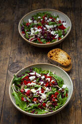 Two bowls of vegetable salad with lentils, arugula, red bell pepper, feta cheese and radicchio - LVF09020