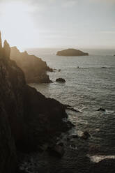 Sunset view of mountain and water against sky - GMLF00644