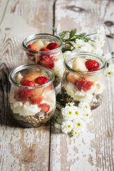 Small jars of sweet layered mascarpone cheese dessert with fruits - EVGF03758