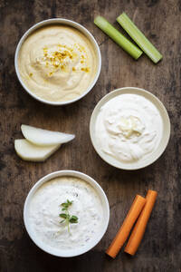 Variety of sour cream with vegetable stick on table - EVGF03782