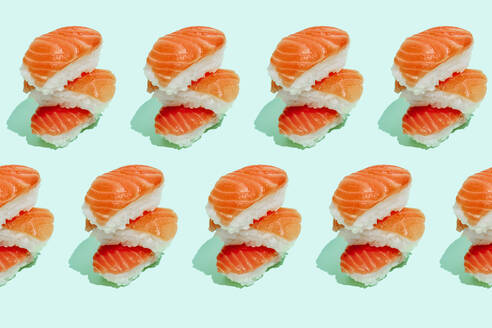 Multiple image of fresh salman sushi nigri on mint green background - GEMF04169