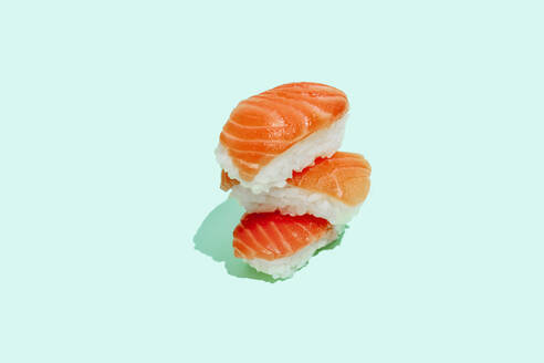 Fresh salman sushi nigri on mint green background - GEMF04170