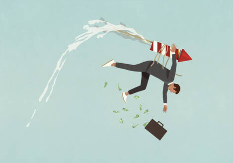 Businessman with rocket strapped to back falling from sky - FSIF05326