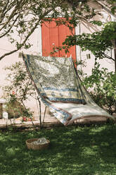 Bed sheet hanging on clothesline at backyard - ALBF01585