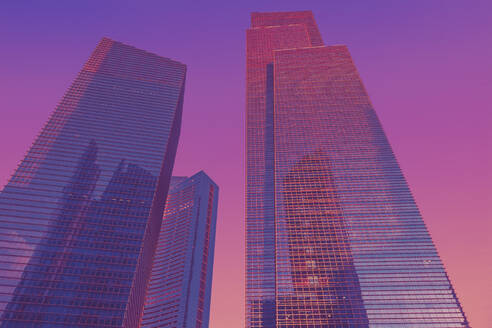 Tall modern skyscraper against sky during sunset - LCUF00136