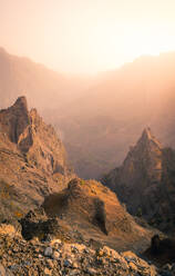 Majestic landscape of mountain range covered with clouds and valley with cloudy sky - ADSF15904