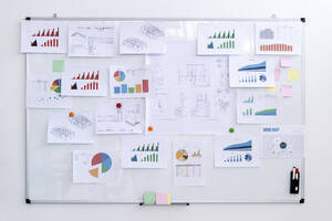 Various charts on whiteboard at creative workplace - GIOF09004