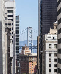 Building with Oakland Bay Bridge in background at  San Francisco, California, USA - AHF00112