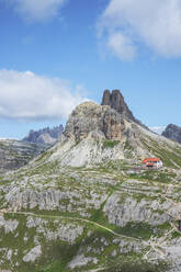 Hut at Tre Cime di Lavaredo against sky on sunny day, Sesto Dolomites, Dolomites, Alto Adige, Italy - MMAF01415