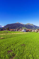 Austria, Tyrol, Ehrwald, Mountain village in Wetterstein Mountains during summer - THAF02893