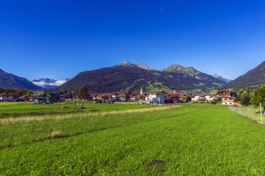 Austria, Tyrol, Ehrwald, Mountain village in Wetterstein Mountains during summer - THAF02894