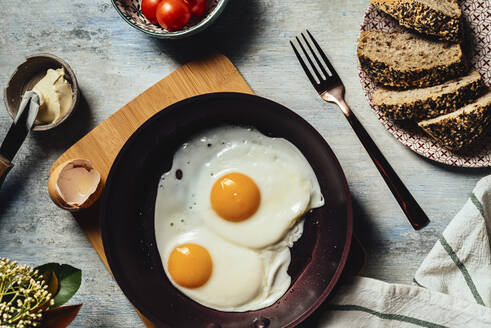Fried egg. view of two fried eggs on a frying pan. ready to eat with breakfast or lunch - ADSF16227