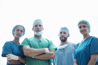 Confident female and male surgeons standing in hospital - AJOF00205