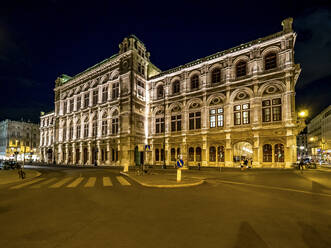 Austria, Vienna, Street in front of Vienna State Opera at night - AMF08548