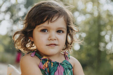 Cute little girl standing at beach on sunny day - MFF06231