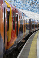 UK, England, London, Subway train waiting at railroad station - MRRF00573