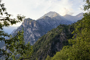Italy, Province of Sondrio, Mountain range in Riserva Naturale Pian di Spagna e Lago di Mezzola at dusk - MAMF01353