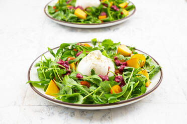 Two plates of vegetarian salad with fruits, vegetables and burrata cheese - LVF09031