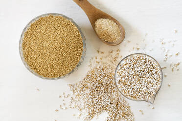 Studio shot of two bowls and ladle of quinoa grains, pops and flakes - EVGF03835