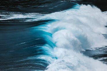 From above view of powerful blue breaking ocean waves with white foam - ADSF16632