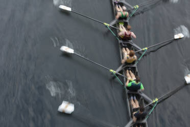 Overhead view of a crew rowing in a four on the surface of a lake. - MINF15214