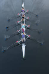 Overhead view of a crew in an eights boat rowing on a lake - MINF15216