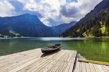 Rowboat left at edge of jetty on shore of Vilsalpsee lake - THAF02934