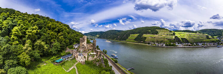 Germany, Rhineland-Palatinate, Trechtingshausen, Helicopter panorama of Rheinstein Castle and river Rhine in summer - AMF08569