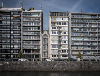 Belgium, Liege Province, Liege, Apartment buildings along city canal - HAMF00756