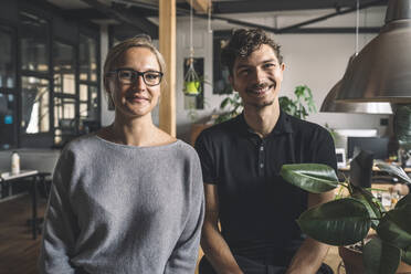 Portrait of smiling computer programmers at workplace - MASF20318