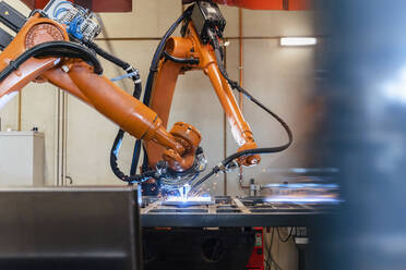 Robotic arms welding in industrial factory - DIGF12933