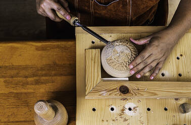 Sculptress carving wooden box. From the top - CAVF89796