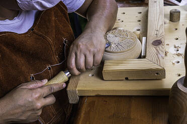 Wood craftswoman carving wooden box - CAVF89856