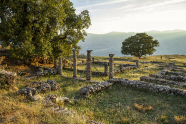 Albania, Gjirokaster County, Ruins of ancient Greek city of Antigonia at sunset - MAMF01373