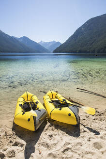 Two packrafts on the shore of a turquoise lake, - CAVF90027