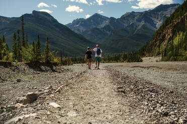 Father and son walking in the mountains - CAVF90037