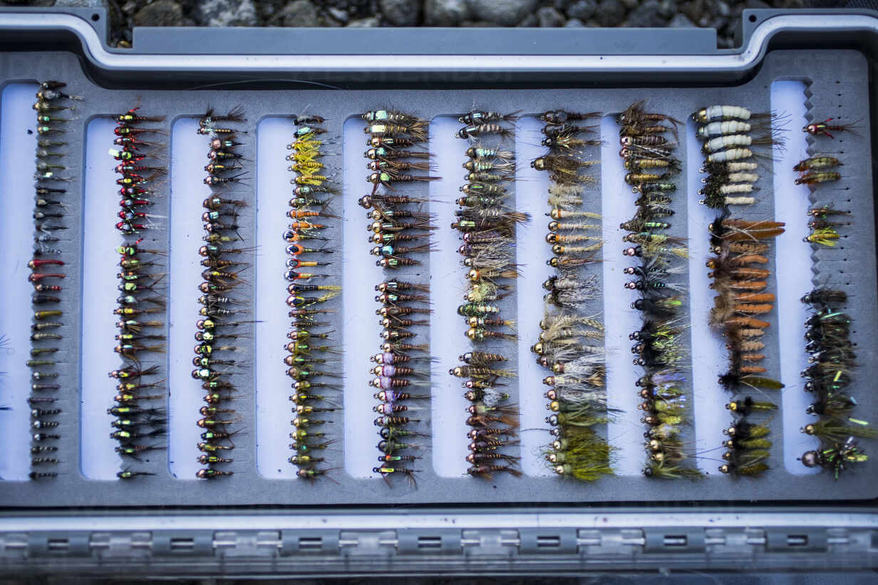 Full tackle box of fly fishing flies in Washington river stock photo