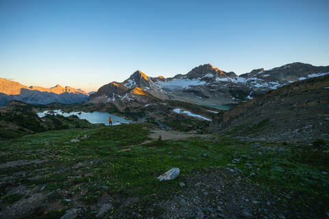 Hiker Watching Sunrise at Limestone Lakes Height of The Rockies stock photo